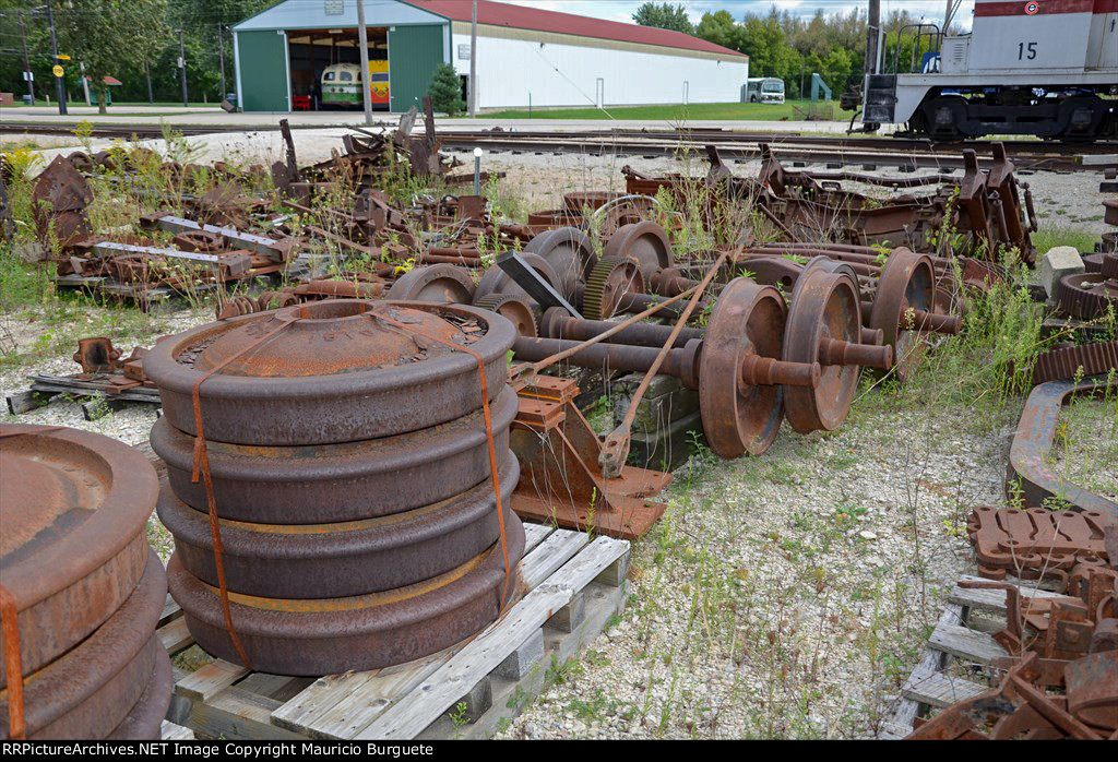 Old Wheels and axles laying on the yard